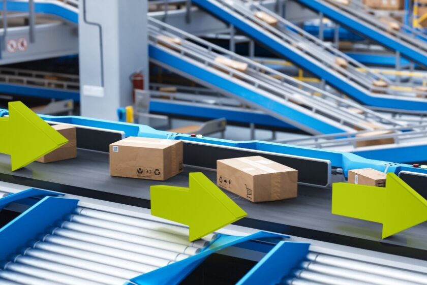 Modern warehouse showcasing automated material flow systems like ASRS and conveyors, symbolizing increased efficiency, margin growth, and operational control.